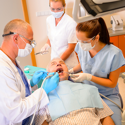 Dental Assistant arranging instruments and materials