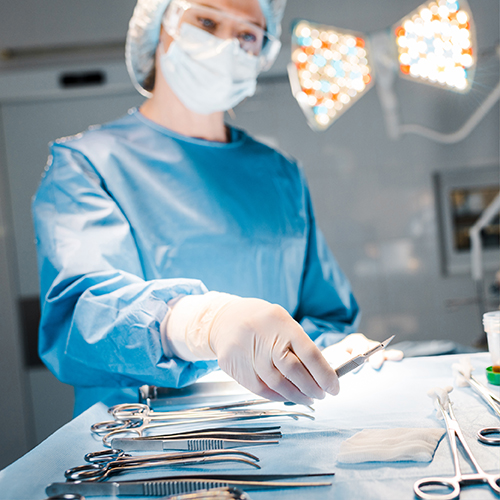 Surgical Technician organizing surgical equipment 