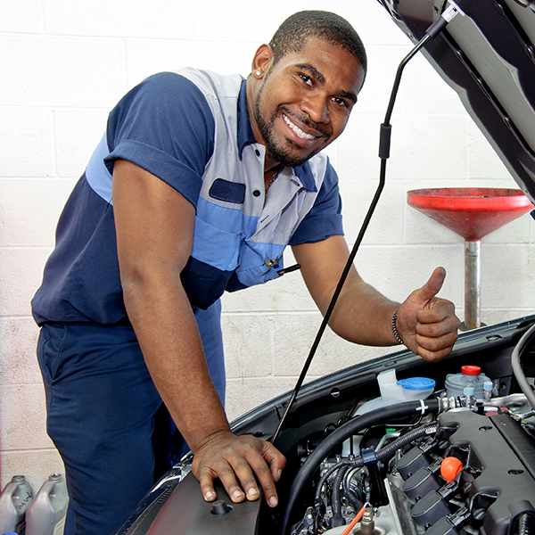 Automotive technician doing a diagnosing problems in a car